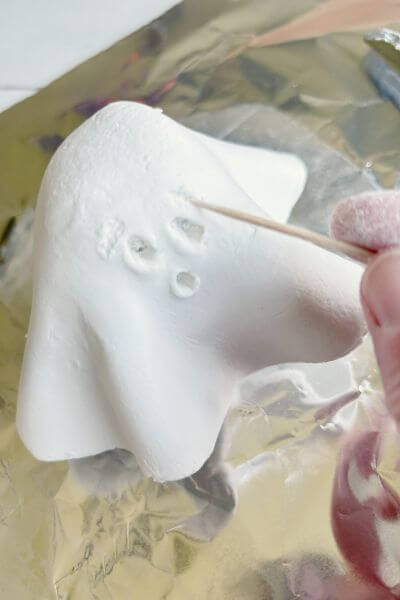 Add eyebrows for expression using the toothpick. 