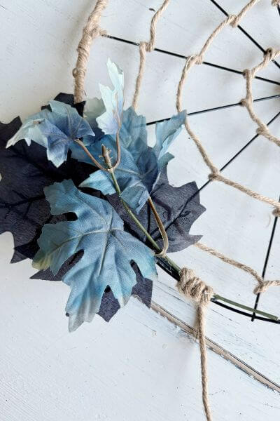 Wrap the jute cord around the dried hot glue to fix the stems in place. 