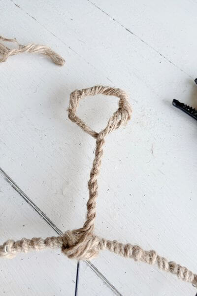 Twist the jute wire together making a line up to a loop. 