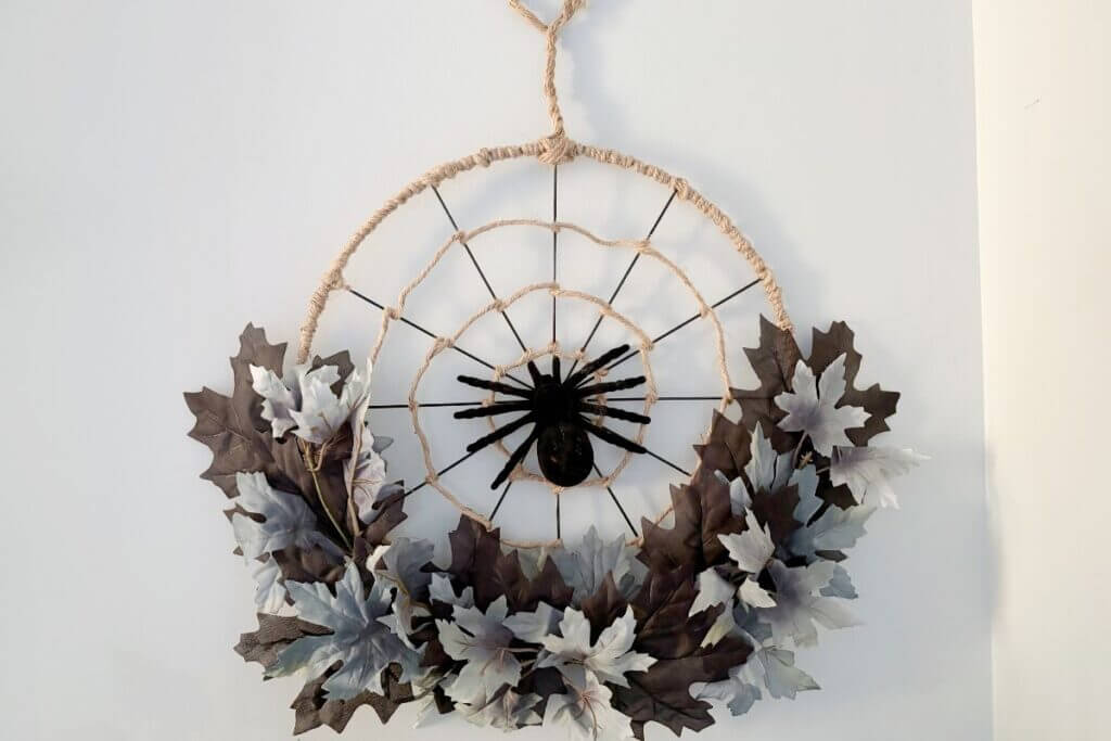 Spider web wreath DIY made with dollar store supplies.