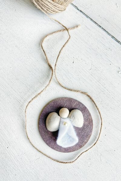 Place jute twine around the ornament, leaving enough room for knotting and a loop. 