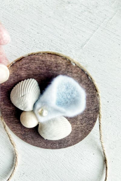 Continue hot glueing around the rim and then adding the jute twine. 