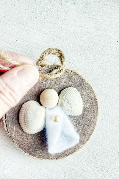 Make another knot by looping it around in the other direction. 