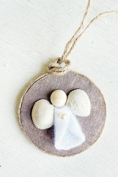 Making a second knot at the top of the ornament. 