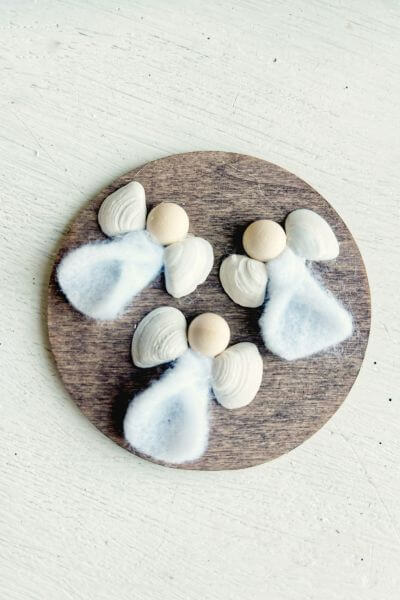 Glue the seashell wings on with the hot glue gun. 