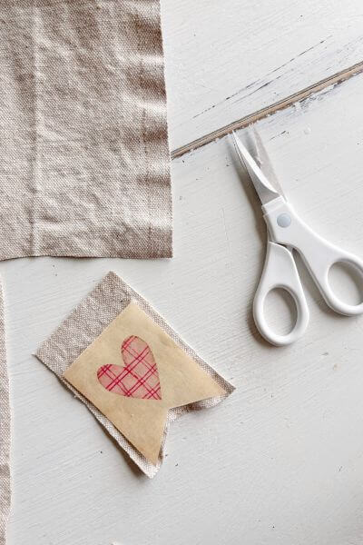 Drop cloth cut in the shape of the paper printable leaving an edge around the outer portion.