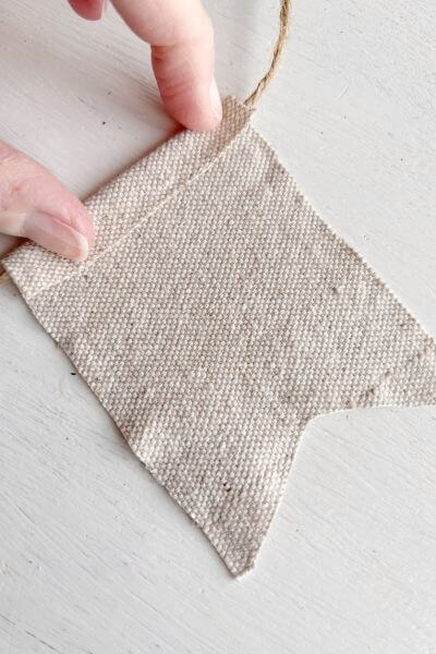 Fold the drop cloth over at the top to get an idea of where to run the hot glue line.