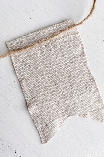 Run a line of hot glue where you want to adhere the drop cloth.