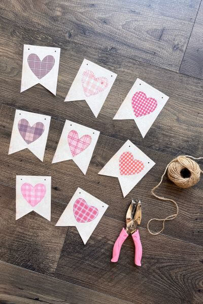 Eight vintage hearts cut out for a banner.