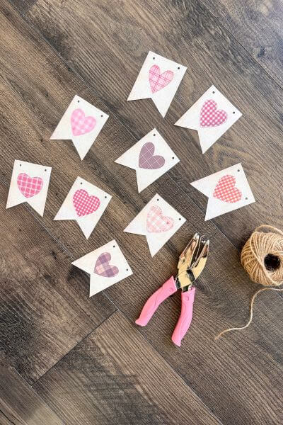Nine vintage hearts cut out for a banner.
