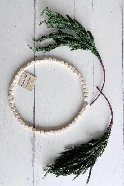Wood bead wreath ring and two evergreen pics.