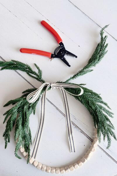 Optionally you can trim a branch from either side if it looks too bushy.