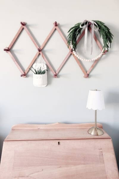 Completed easy farmhouse evergreen wood bead wreath DIY.