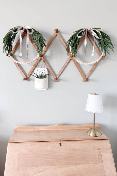 Two completed easy farmhouse evergreen wood bead wreath DIY.