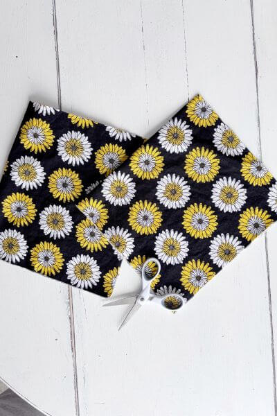 Cut fat quarter of fabric into two pieces.