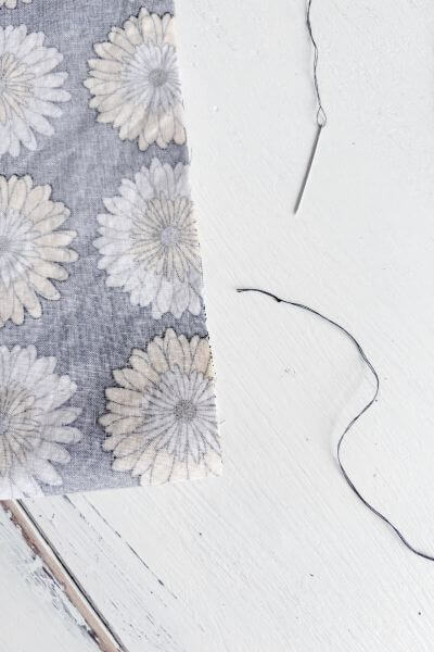 Thread the needle and make a double or triple knot at the end.