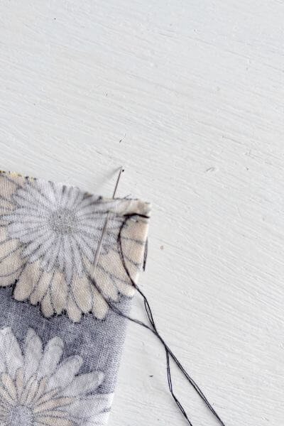 Bring the thread through to the other side.