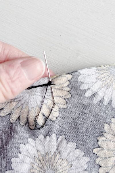 Push the loops down toward the fabric.