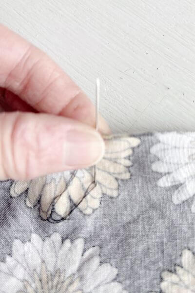 Hold down the loops with your thumb.