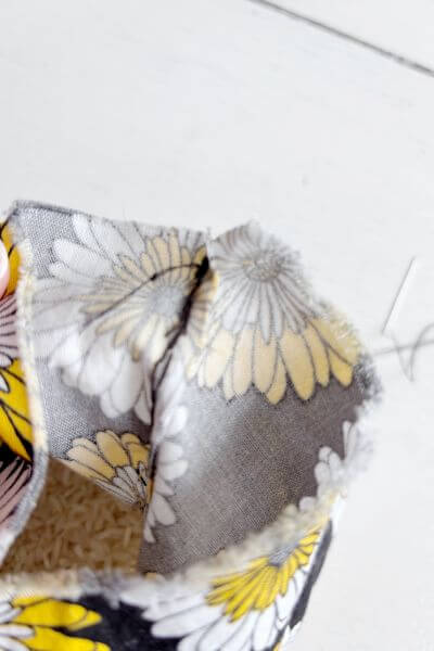 Hide the initial knot by taking it through the fabric on the inside before pinching it closed.