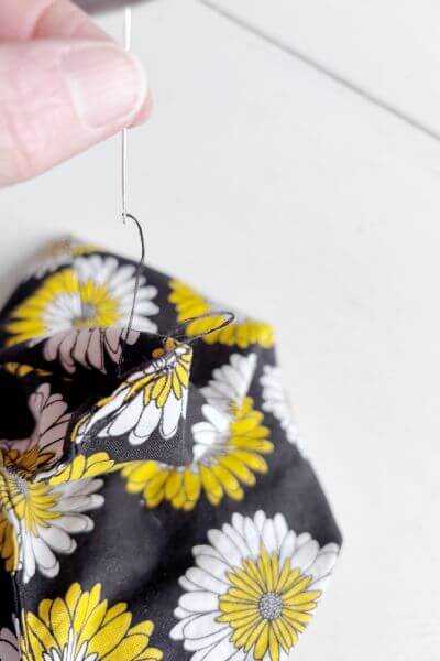 Pull the thread through making the knot.