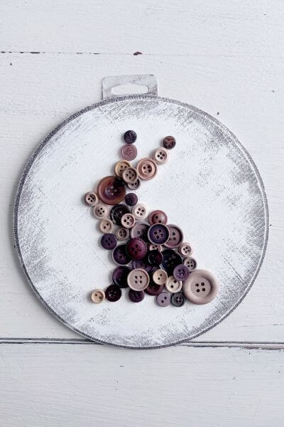 Second rabbit design using buttons on wood round.