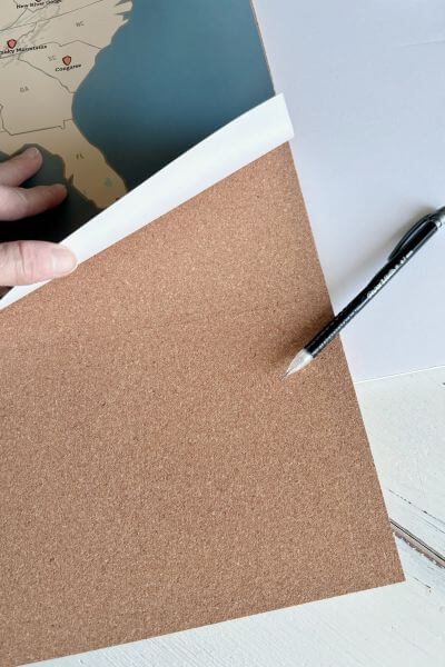 Line placed on the third cork board at the bottom of the map where you'll make a cut.