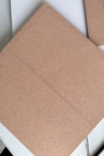 Two lines made on the third piece of cork to use for the bottom part of the map.