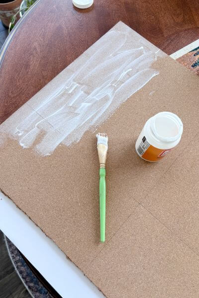 Apply mod podge to cork.