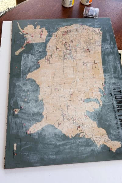 Mod podge applied over map with foam brush.