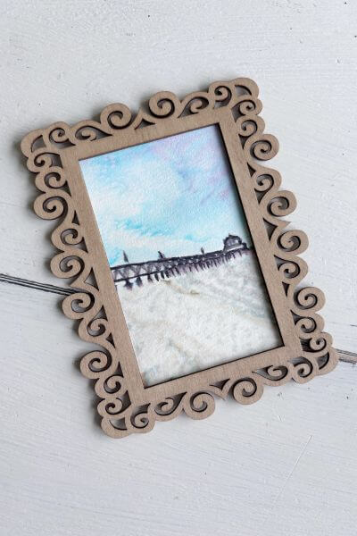 Connect the watercolor picture to the frame using the tacky dot runner.