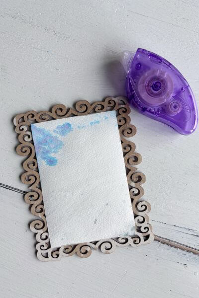 Tacky dot runner beside watercolor picture on frame.