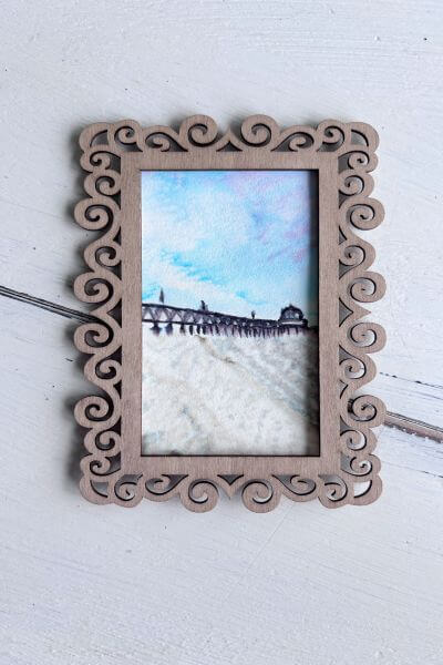 Picture in frame to make sure no edges are showing through to the front.