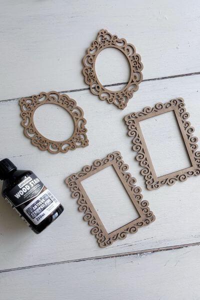 Four stained wood frames.