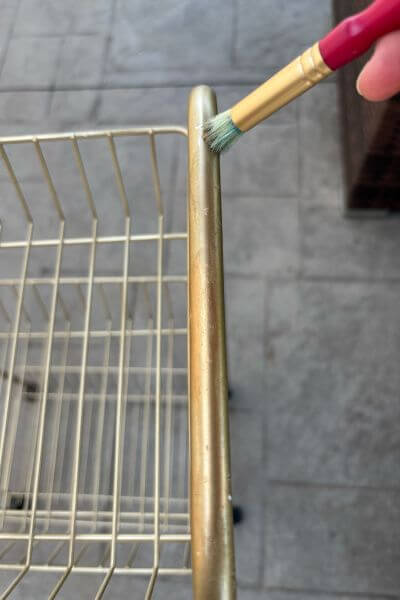 Paint Rub n' Buff onto the cart to cover scratch marks.